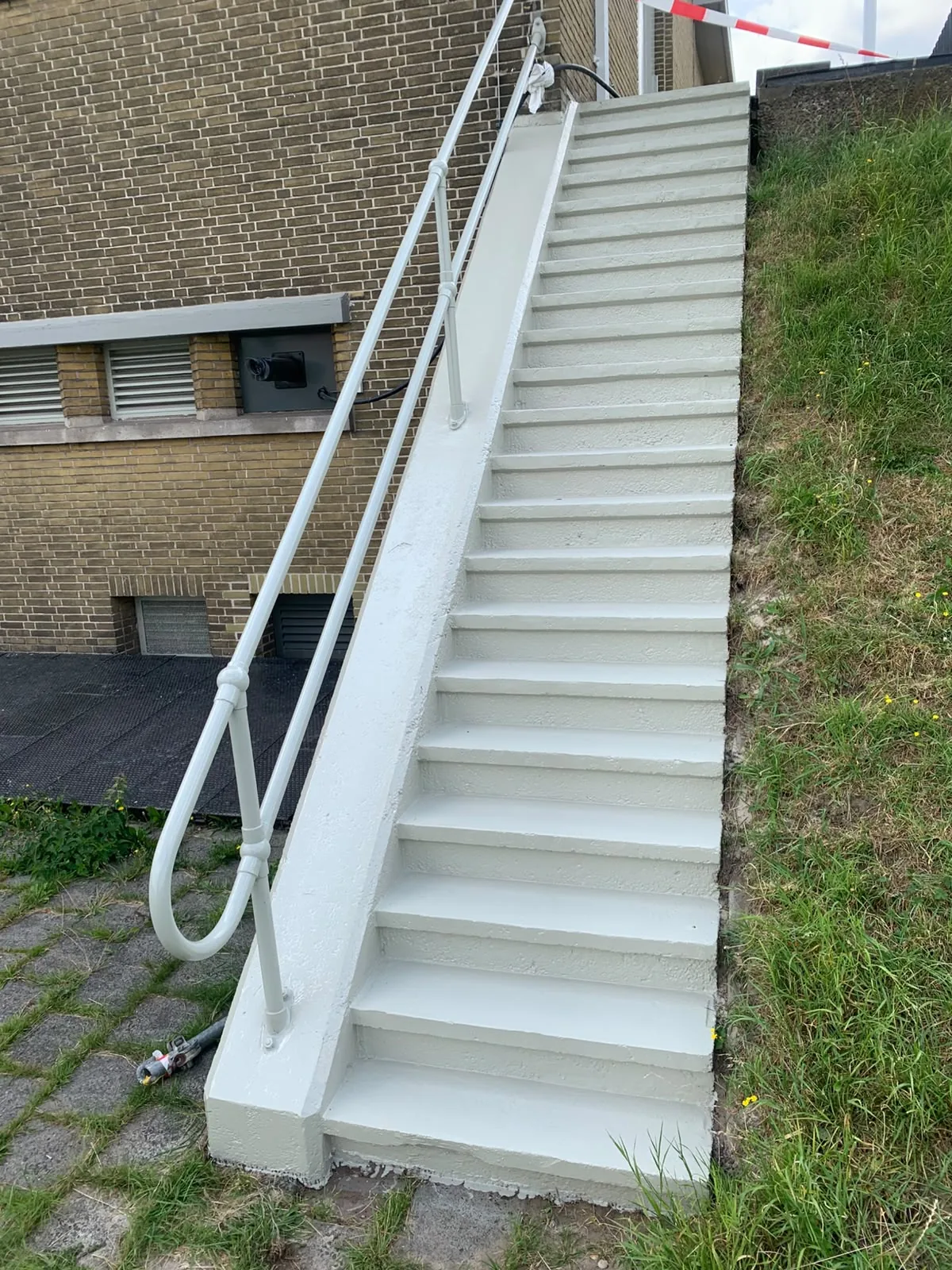 Comforcoat slip-resistant coating on an external staircase and concrete plinths for plant equipment