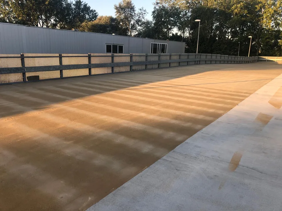 Comforpark Deck on a rooftop car park with a balustrade, seen along the length of the deck